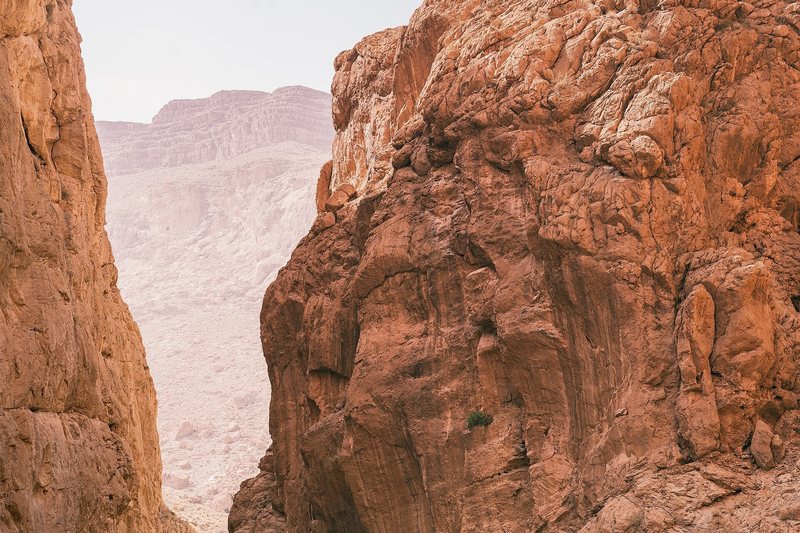 Motorcycle riders through towering Todra Gorge Morocco