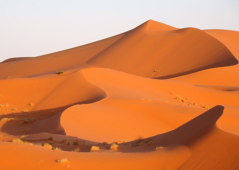 Enduro motorcycle riding through Moroccan Sahara Desert trail
